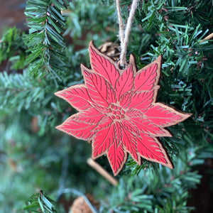 Poinsettia Wood Ornament hanging on tree