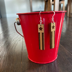 Rectangle Star & Stripes wood earrings hanging on red bucket